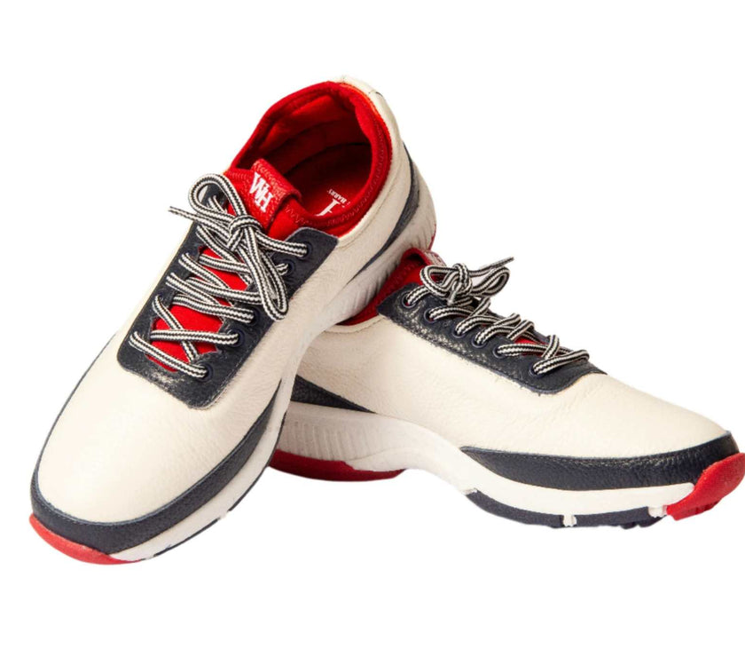 Women's Lynx deerskin golf shoes in navy and red with leather accents, spikeless design.