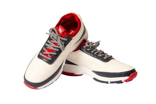 Women's Lynx Deerskin Golf Shoes in navy and red, featuring deerskin and calfskin leather, spikeless outsole, and red accents for stylish golfing.