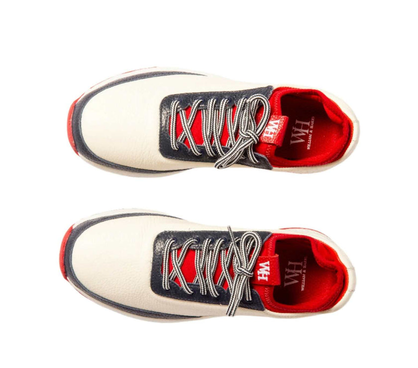 Women's navy and red Lynx Deerskin Golf Shoes with spikeless outsole and cushioned interior.