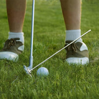 Under Par Discount Golf practicing putting with alignment rod beside putter and ball golf alignment rods sale