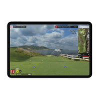 Tablet showing golf simulator view of Pebble Beach course with distance readout, FlightScope Mevo Plus launch monitor in use