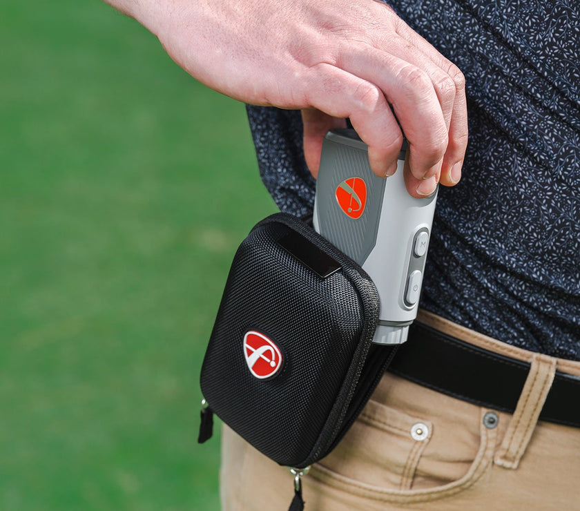 FlightScope i4 Golf Rangefinder held in hand with a stylish storage pouch attached to the belt