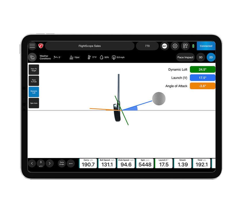 FlightScope tablet display showing golf swing analysis software with club and ball vectors premium golf training equipment