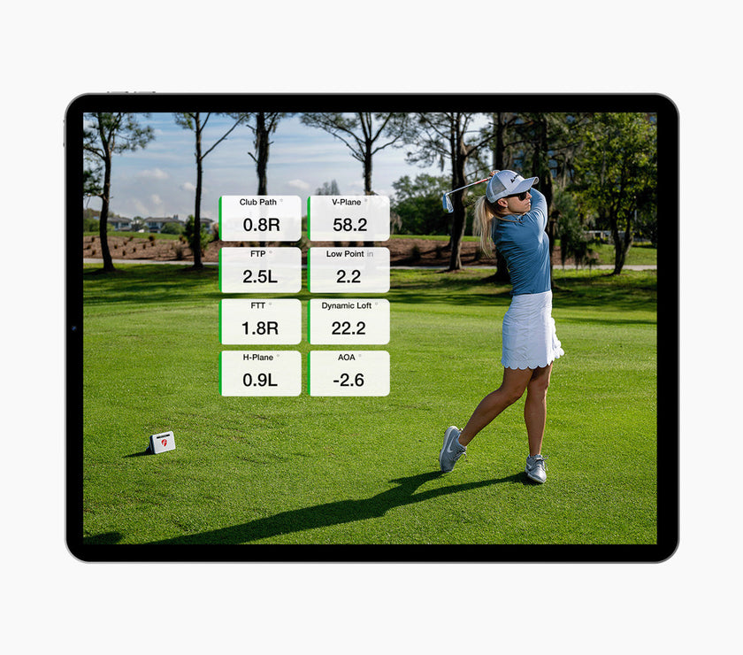 FlightScope Golf US Store app on tablet showing swing metrics and a female golfer using premium golf training equipment