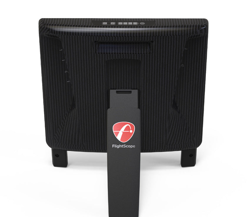 FlightScope X3C Launch Monitor with carbon-fiber housing and stand, rear view.