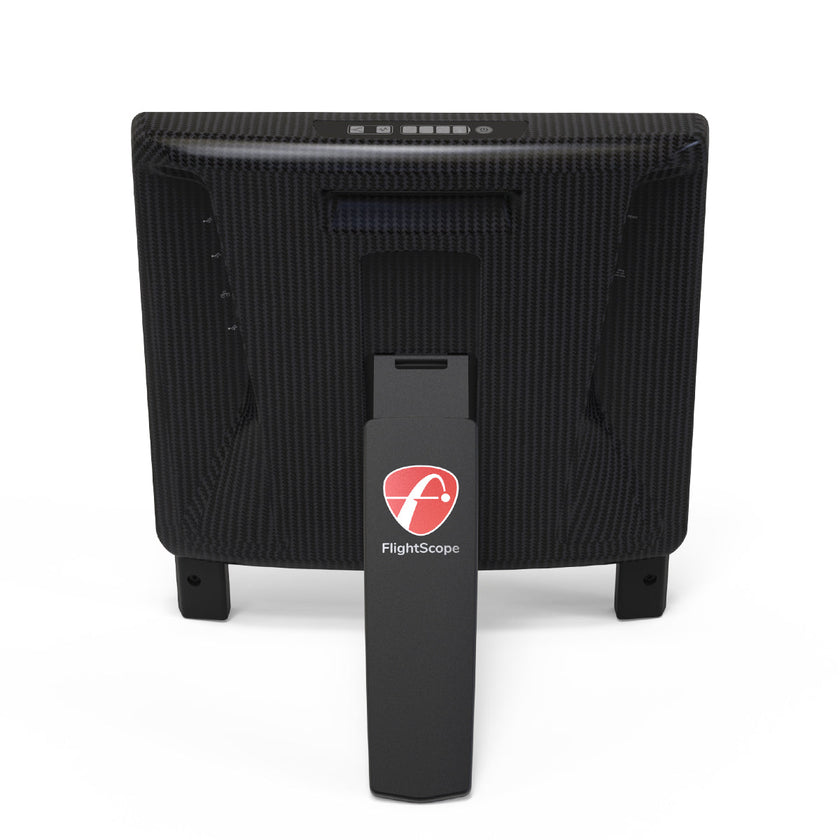 FlightScope X3C Launch Monitor with carbon-fiber housing and stand, rear view.
