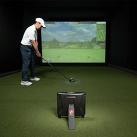 Golfer using the FlightScope X3C Launch Monitor in indoor simulator.