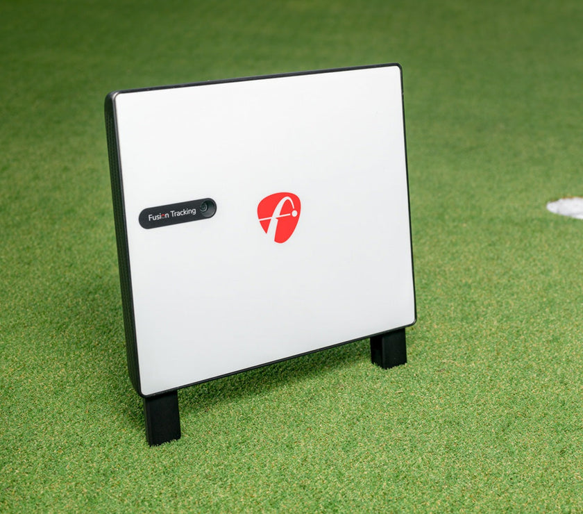 FlightScope X3C Launch Monitor on grass displaying Fusion Tracking technology.