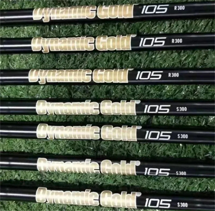 Dynamic Gold 105 golf club shafts for forged golf club set on grass background
