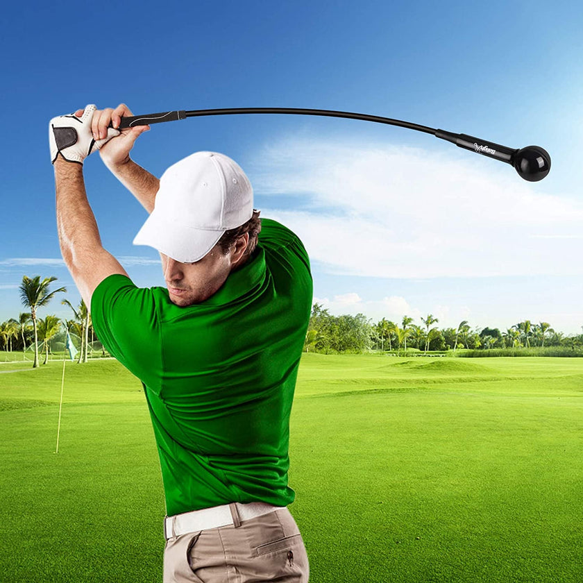 Golfer using Under Par Golf Swing Trainer Stick on a sunny golf course for practice.
