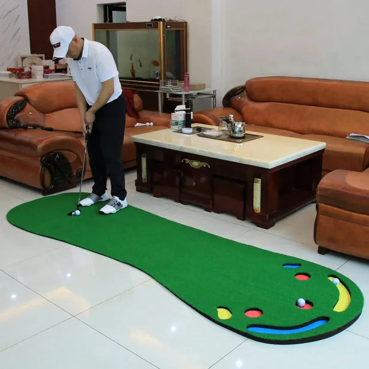Golfer using green indoor putting practice mat in living room with multiple target holes and furniture