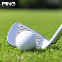PING high rebound pitching wedge positioned next to a golf ball on lush grass