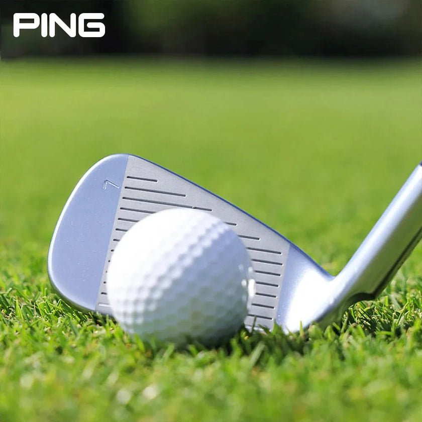 PING high rebound pitching wedge positioned next to a golf ball on lush grass