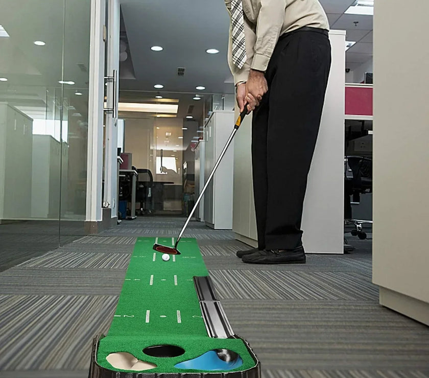 Under Par Discount Golf indoor putting mat set on office floor with man in dress pants practicing putt with two holes and guides