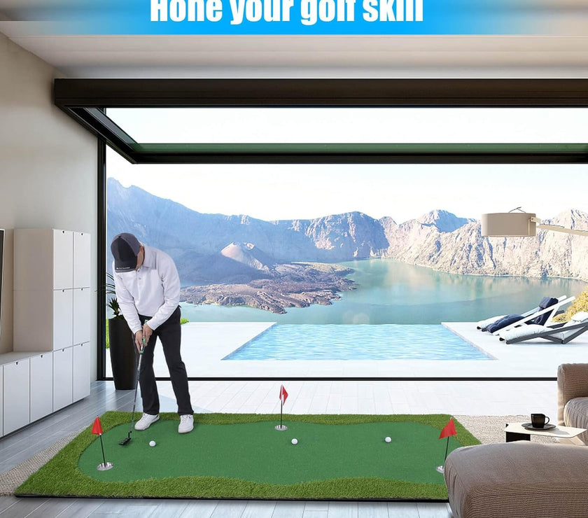 Man practicing putts on indoor golf putting green mat in modern living room with pool and mountain view