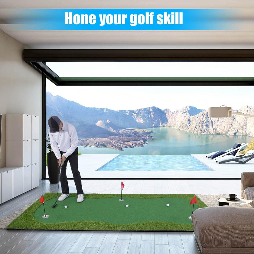 Man practicing putts on indoor golf putting green mat in modern living room with pool and mountain view