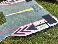 Clear plastic golf alignment board with arrows and velcro on grass Speed Trap swing trainer