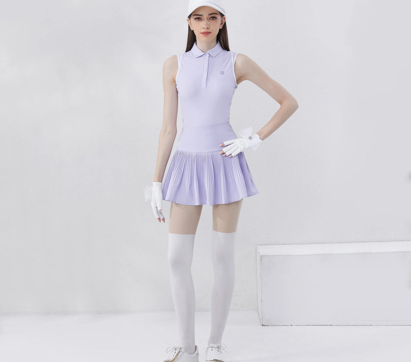 Women's golf polo shirt in light purple paired with a pleated skirt for stylish performance on the course