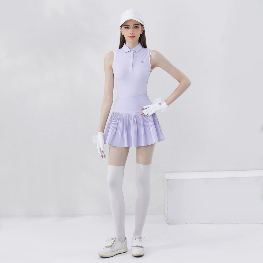 Women's golf polo shirt in light purple paired with a pleated skirt for stylish performance on the course