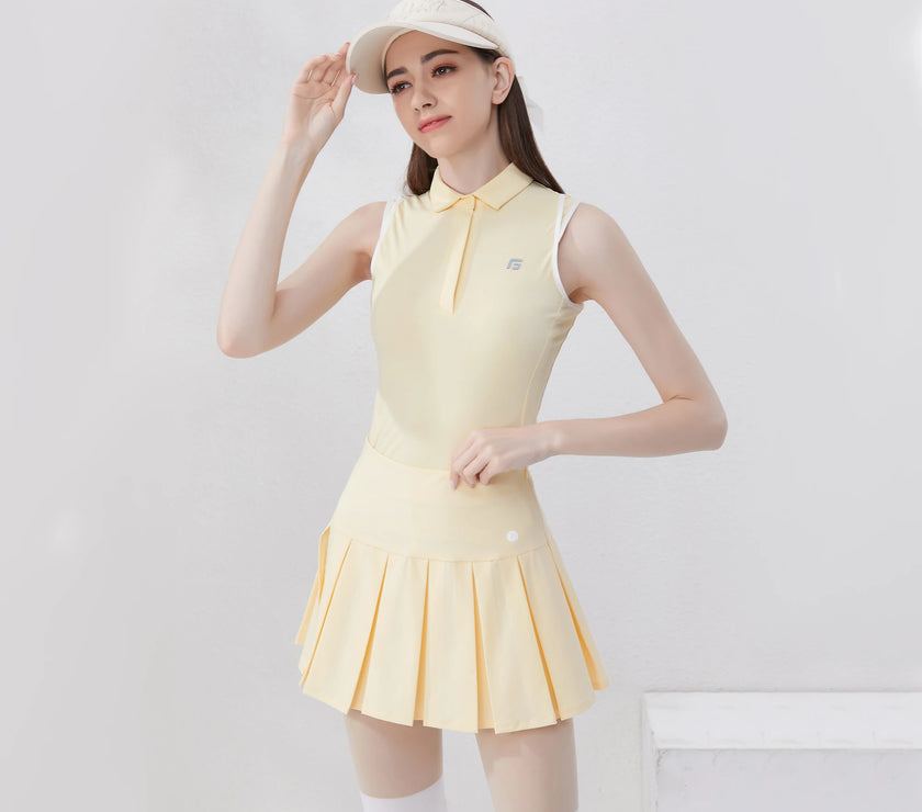 Stylish women's golf polo shirt in yellow with a pleated skirt and sporty design for female golfers
