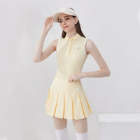 Stylish women's golf polo shirt in yellow with a pleated skirt and sporty design for female golfers